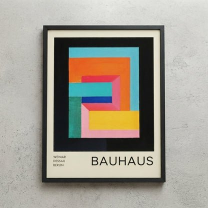 Framed Bauhaus Geometric Abstract Art Print with colorful geometric design on a gray wall.