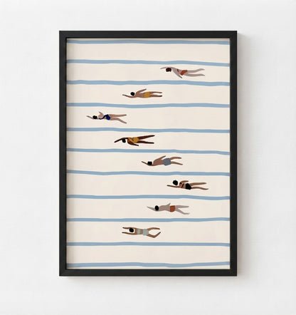 Framed wall art featuring a minimalist illustration of people swimming horizontally across cream-colored water with light blue stripes, displayed in a black frame against a white wall.